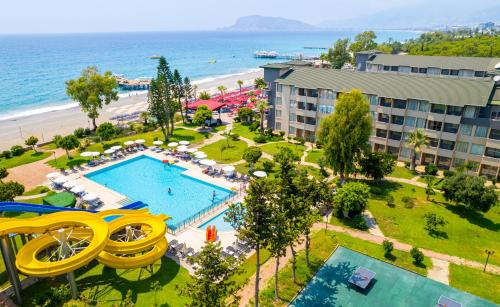 an aerial view of a resort with a swimming pool and a beach at Senza Sunset Beach Hotel in Alanya
