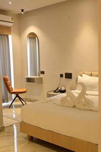 Postel nebo postele na pokoji v ubytování Hotel Shellmark