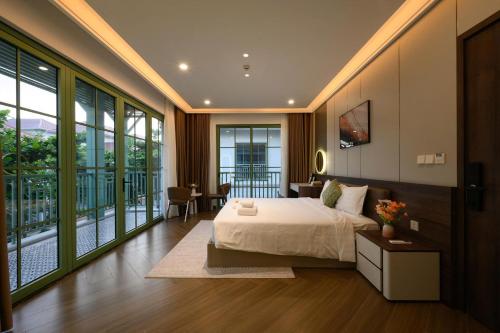 Кровать или кровати в номере Elyday Villa - Bai Khem Beach, Phu Quoc