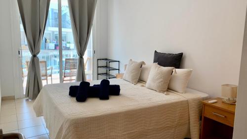 En eller flere senge i et værelse på Apartamento La Arena Puerto Santiago