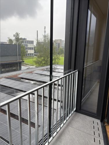 a balcony with a view of a building at Herburger Living in Dornbirn
