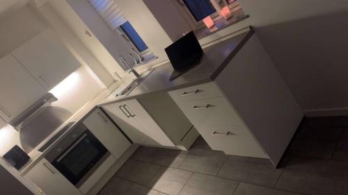 an overhead view of a kitchen with a counter top at Cozy New Apartment in Vejle City Center in Vejle