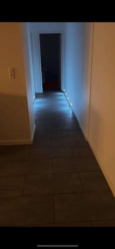 an empty hallway with a tile floor in a room at Cozy New Apartment in Vejle City Center in Vejle