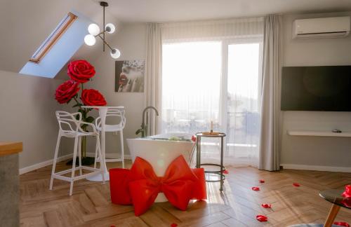a living room with red bows on the floor at "The House" Апартаменти и Термална зона in Velingrad