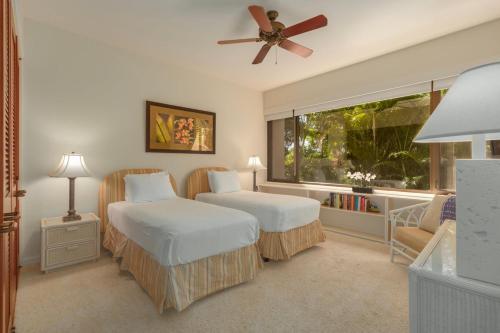 Ένα ή περισσότερα κρεβάτια σε δωμάτιο στο Enjoy Ocean Views from Mauna Lani Point A105