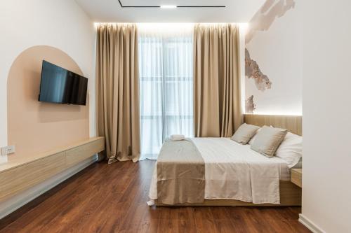 Kingdom Family Apartment's Durres Centerにあるベッド