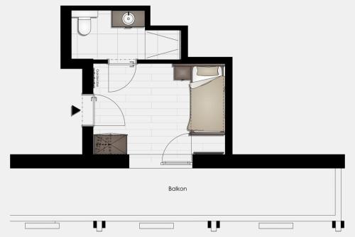 a floor plan of a bathroom with a toilet at Hotel Erlebniswelt Stocker in Schladming
