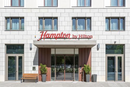 a sign for a hampton by hilton building at Hampton By Hilton Dresden City Centre in Dresden