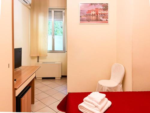 Postel nebo postele na pokoji v ubytování Sullivan Ristorante Hotel