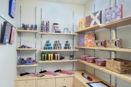 a room with shelves with items on them at Crowne Plaza Alice Springs Lasseters by IHG in Alice Springs