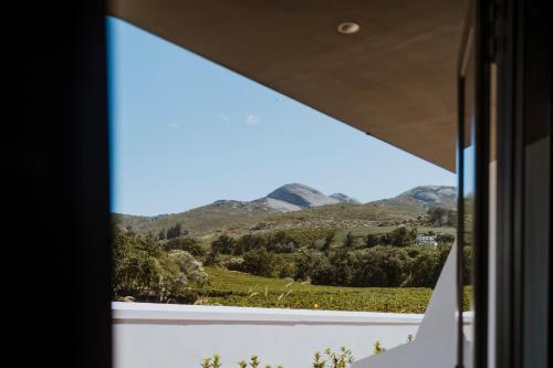 a window view of a mountain view from a house at Laborie Estate in Paarl