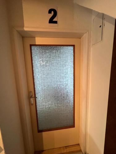 a door with a number on the top at Vienna Touch Apartments Number 1 in Traiskirchen