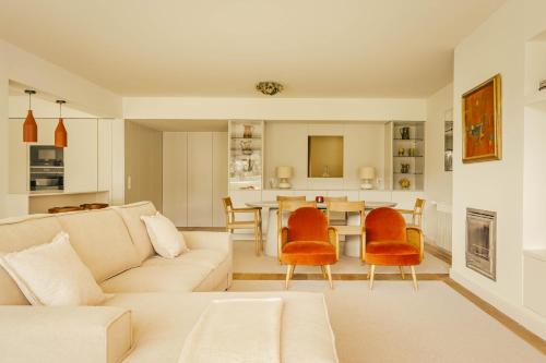 a living room with a couch and a table at Casa Cascais Riviera - Deluxe 3 Bedroom Apartment in Cascais