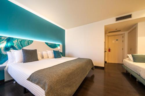 Postel nebo postele na pokoji v ubytování Hotel Concordia Barcelona