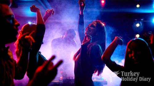 a group of people dancing at a concert at A dream house with a dream view in ROYAL PARK in Alanya