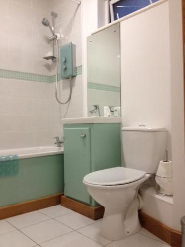 a bathroom with a toilet and a sink and a shower at Galway City Self Catering - Salthill in Galway
