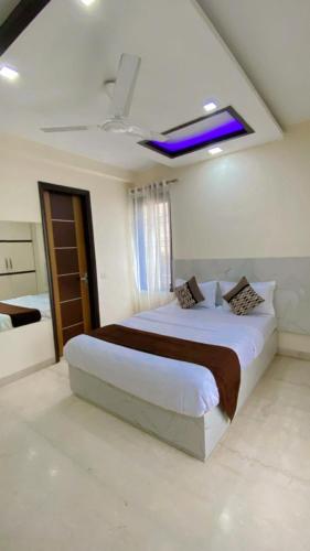 a bedroom with a large bed in a room at Cassava Stay in New Delhi