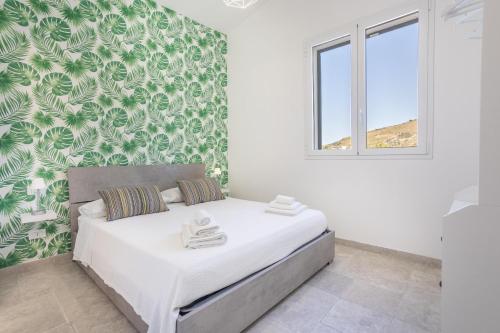 Ένα ή περισσότερα κρεβάτια σε δωμάτιο στο Villa Aurora