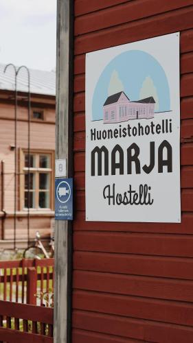 a sign on the side of a building at Hostelli Marja in Mikkeli