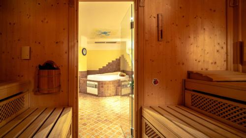 a small room with a bathroom with a tub at Appartementanlage Kerber in Seefeld in Tirol