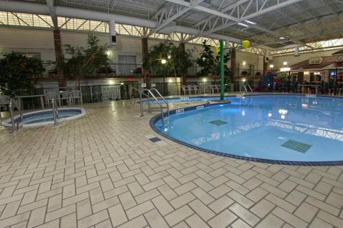 a large swimming pool in a building at Victoria Inn Hotel & Convention Centre Brandon in Brandon