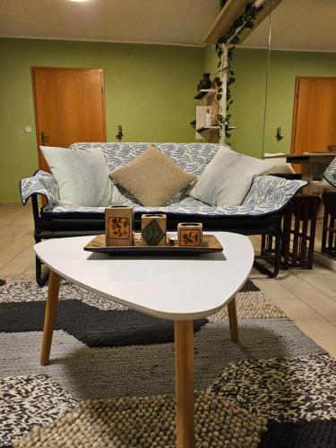 a living room with a couch and a table at Radoslove Apt in Radovljica