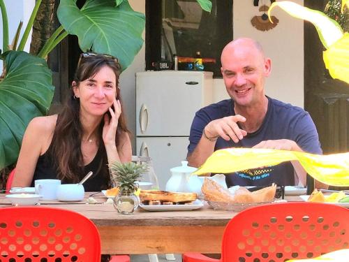 a man and a woman sitting at a table at Ocean Beach House in Matara