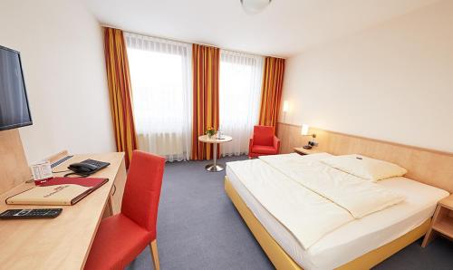 Ένα ή περισσότερα κρεβάτια σε δωμάτιο στο Hotel Filderland - Stuttgart Messe - Airport