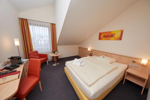 Ένα ή περισσότερα κρεβάτια σε δωμάτιο στο Hotel Filderland - Stuttgart Messe - Airport