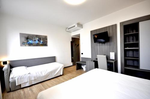 Postel nebo postele na pokoji v ubytování Hotel Igea
