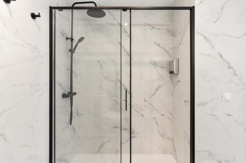 a shower with a glass door in a bathroom at Mar del Sur in Benalmádena