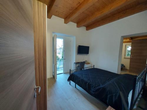a bedroom with a bed and a television in a room at Al Monumento bed & breakfast in Amantea