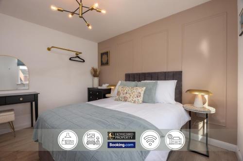 a bedroom with a bed and a desk and a bed sidx sidx sidx at Luxuriou 5 Bedroom House By Homebird Property Management Short Lets & Serviced Accommodation Leeds With Private Parking & Free WiFi in Leeds