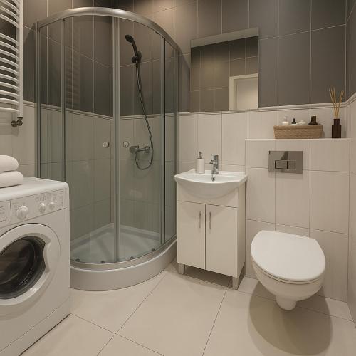 a bathroom with a shower and a toilet and a sink at TANIE NOCLEGOWANIE in Katowice