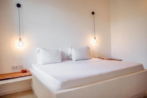 Ένα ή περισσότερα κρεβάτια σε δωμάτιο στο Cactus lodge Zanzibar