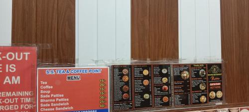 two boxes of donuts are sitting on a shelf at Little KANHA ji PG 10 Room82798s58346 Hotal, also taxi and Activa rent in Mathura
