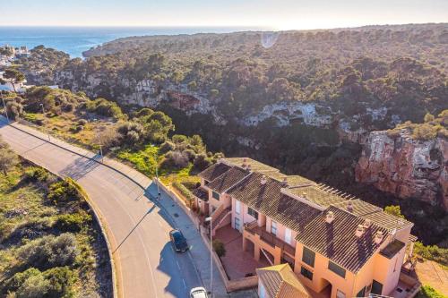 an aerial view of a house with a view of the mountains at The Torrent's Observer Holiday Home, Cala Pi , Smart Tv, Free Wifi, ETV12544 in Cala Pi