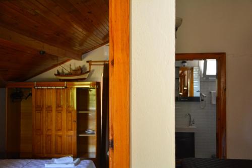 a view of a room with a kitchen and a room at İlçayto Rooms in Foca