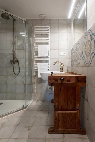 a bathroom with a sink and a shower at Osada Dębno 