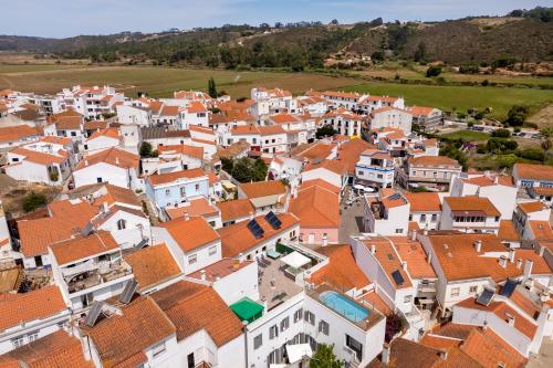 an aerial view of a village with orange roofs at AL-Odeceixe Verde in Odeceixe