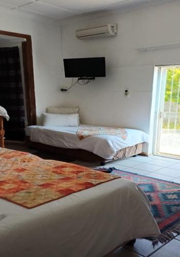 Katil atau katil-katil dalam bilik di Herb Garden Guesthouse