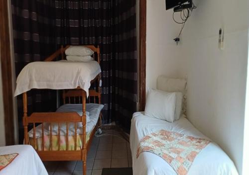 Katil atau katil-katil dalam bilik di Herb Garden Guesthouse