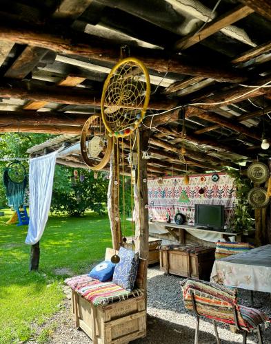 a room with a fan hanging from a wooden ceiling at Cozy Family Home 
