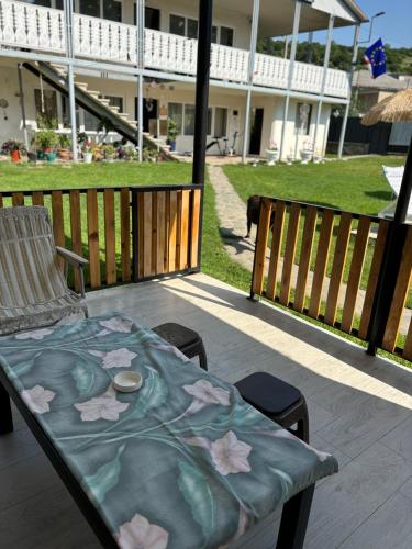 a table with flowers on it on a patio at Cozy Family Home 