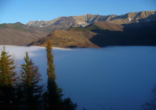 a large body of water with trees and mountains at Casa di nonno Memé CITRA 008035-LT-0018 in Andagna