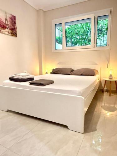 Ένα ή περισσότερα κρεβάτια σε δωμάτιο στο Xsoma Flats "Studio"