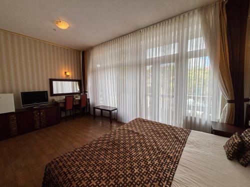 Katil atau katil-katil dalam bilik di Odeska Astoria Arcadia Hotel