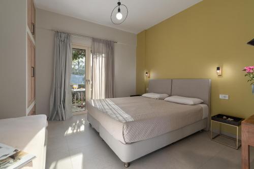 Cama o camas de una habitación en Lemonia Accommodations