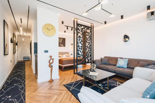 a living room with a couch and a table at Giardino Lux Apartments in Ulcinj