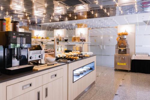 a kitchen with a counter with food on it at Civis Jaime I in Castellón de la Plana